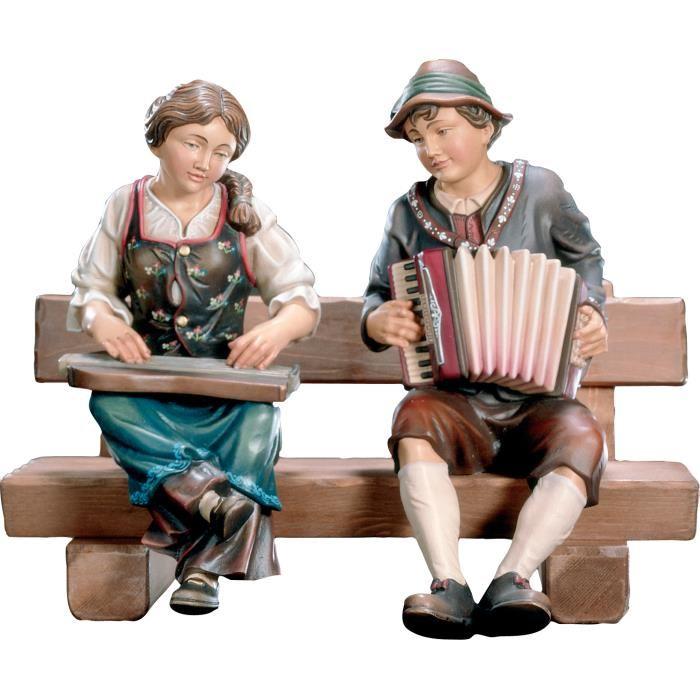 Zither- und Ziehharmonikaspieler-holz geschnitzt