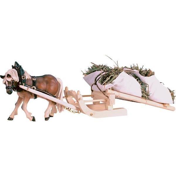 zugpferd mit heuschlitten und heu traditionell gestaltet